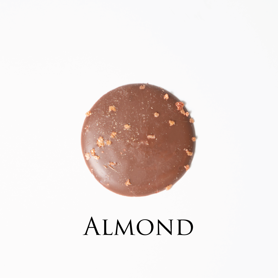 Almond chocolate! Delicate chocolate palet, milk and dark collection. Yann Haute Patisserie, best cakes in this authentic & traditional French bakery & pastry shop in a yellow house in Calgary. Relais Desserts Pastry chef Yann Blanchard creates fresh desserts, cakes, macarons, ice cream, Canneles, croissants, baguette & bread.