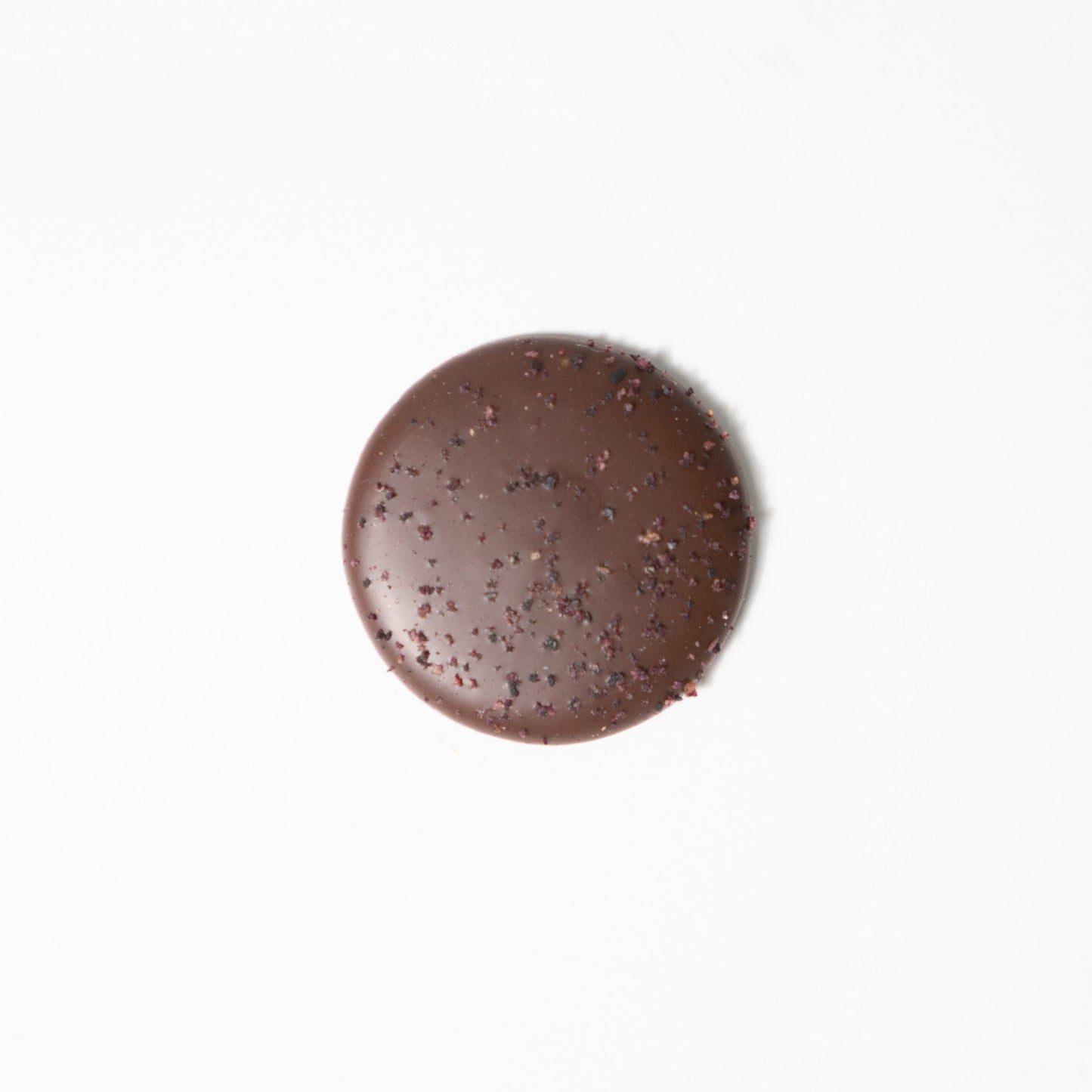 Blueberry Chocolate palet made with Valrhona, best chocolate. Only real and natural ingredients at Yann Haute Patisserie, authentic & traditional French bakery & pastry shop in a yellow house in Calgary. Relais Desserts Pastry chef Yann Blanchard creates desserts, cakes, macarons, ice cream, Canneles, croissants, baguette & bread.