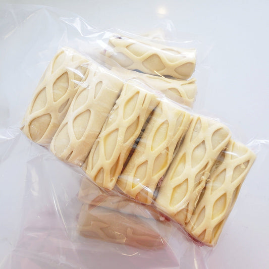 Sausage rolls (pork) from a local family farm in our handmade buttery dough at Yann Haute Patisserie!