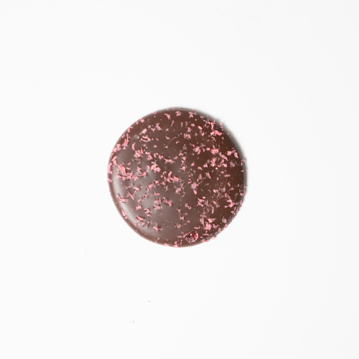 Raspberry, rose, lychee Chocolate palet made with Valrhona, best chocolate. Only real and natural ingredients at Yann Haute Patisserie, authentic & traditional French bakery & pastry shop in a yellow house in Calgary. Relais Desserts Pastry chef Yann Blanchard creates desserts, cakes, macarons, ice cream, Canneles, croissants, baguette & bread.