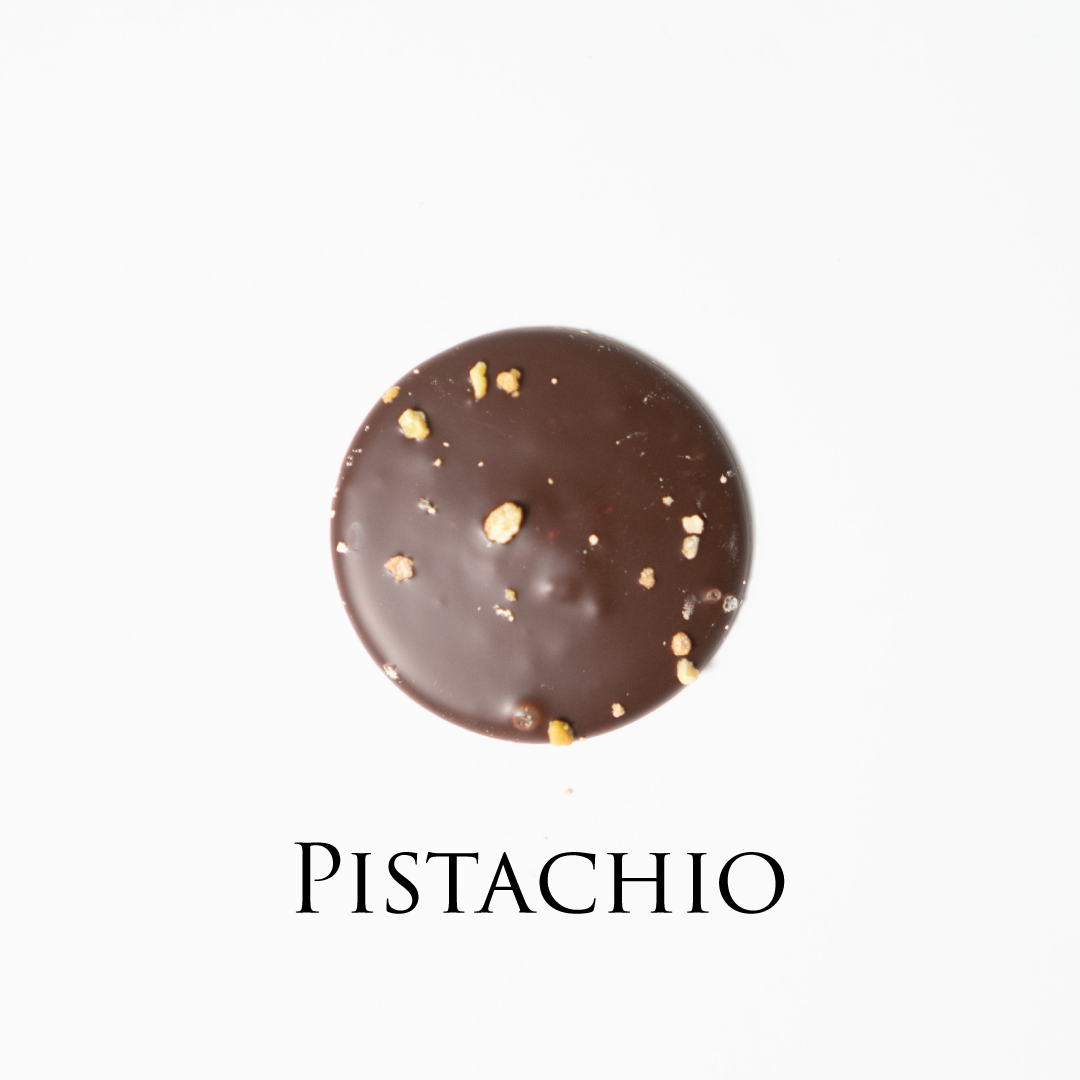 Pistachio chocolate! Delicate chocolate palet, milk and dark collection. Yann Haute Patisserie, best cakes in this authentic & traditional French bakery & pastry shop in a yellow house in Calgary. Relais Desserts Pastry chef Yann Blanchard creates fresh desserts, cakes, macarons, ice cream, Canneles, croissants, baguette & bread.