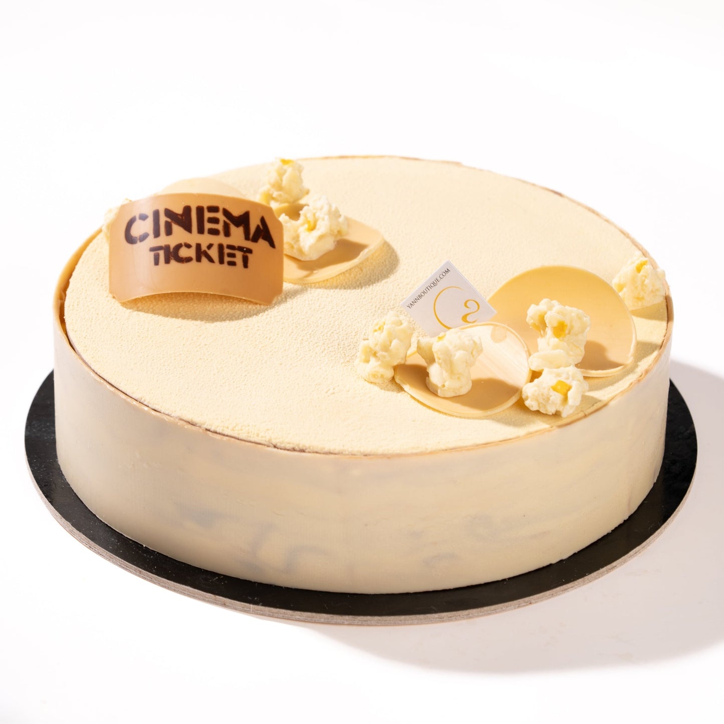 Limited-edition Father's Day collection with popcorn-inspired desserts including cake, chocolate cloche treat, and caramel popcorn croissant.