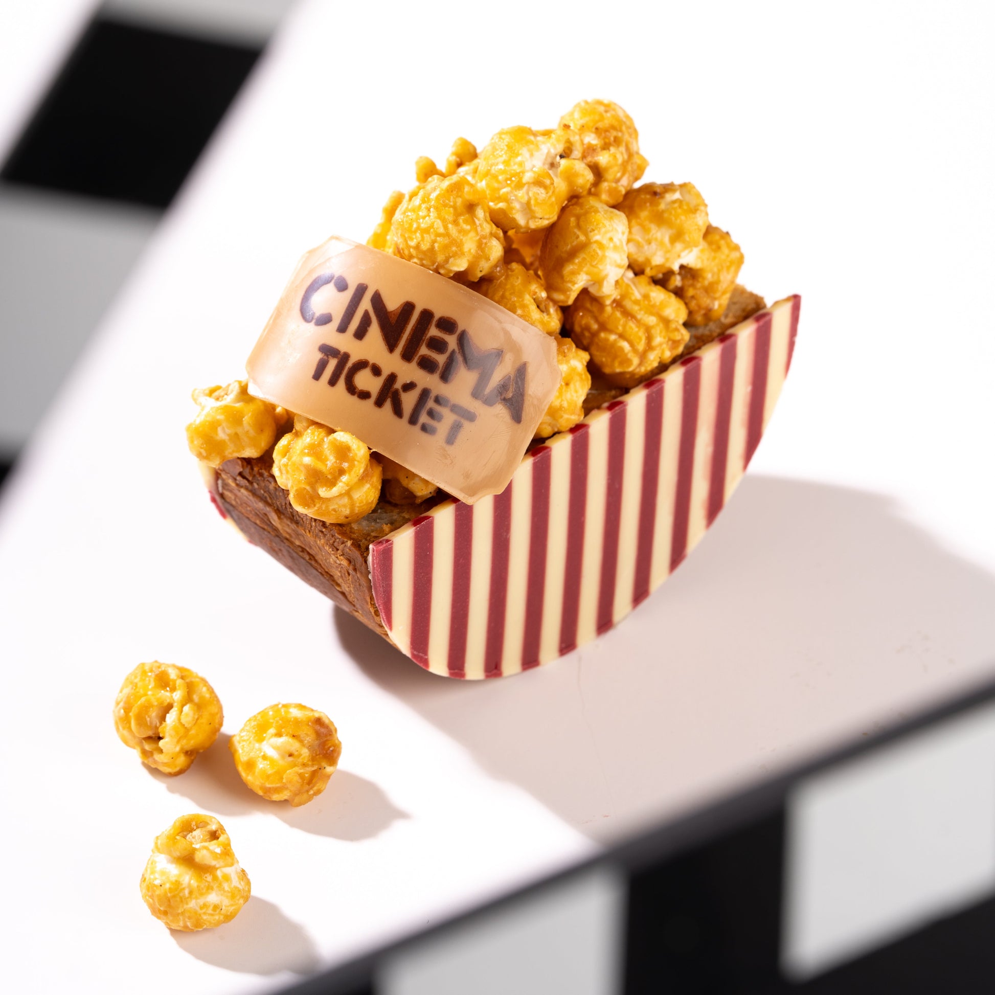 Three Father's Day creations inspired by movie-night popcorn featuring crunchy textures, chocolate, caramel, and French pastry craftsmanship.