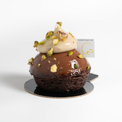 French chocolate pistachio dessert with dark chocolate crème brûlée, whipped pistachio ganache and pistachio brownie.