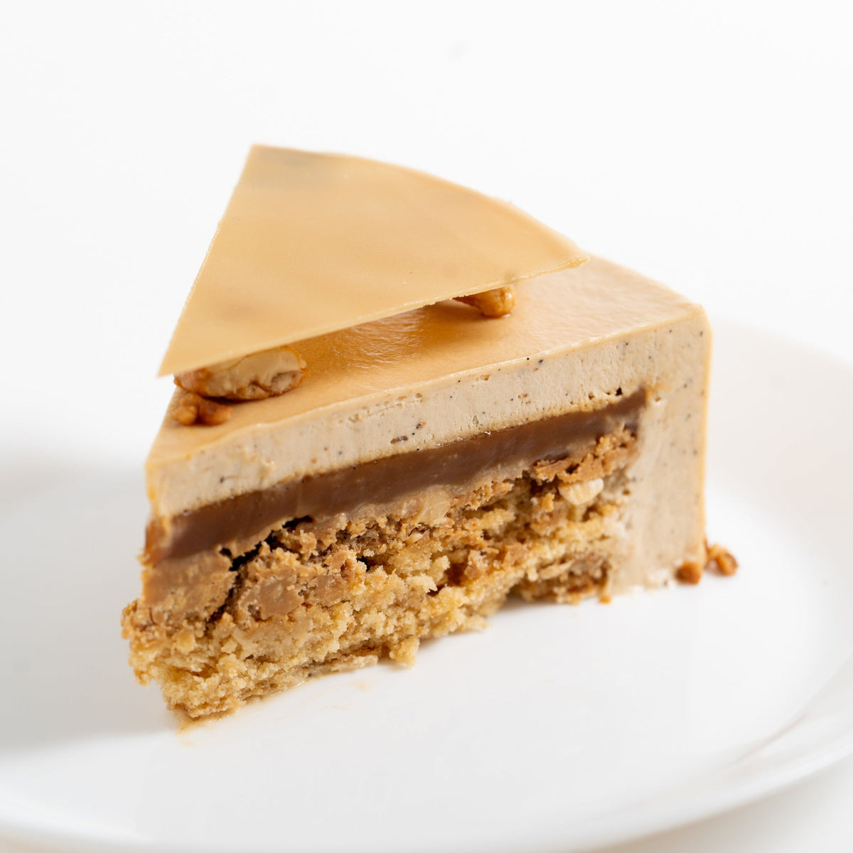 Sacher Doré featuring Dulcey caramel Sacher cake, salted caramel crunch and creamy cashew caramel layers.