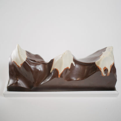 Luxury mountain-inspired chocolate bar with white chocolate hazelnut crunch praliné peaks, handcrafted in Calgary.