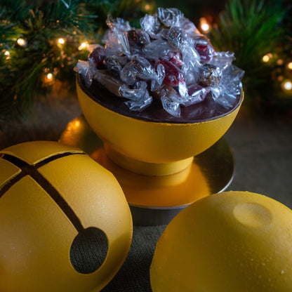 Dark chocolate and caramel holiday cake with vanilla marshmallows and strawberry pâte de fruit