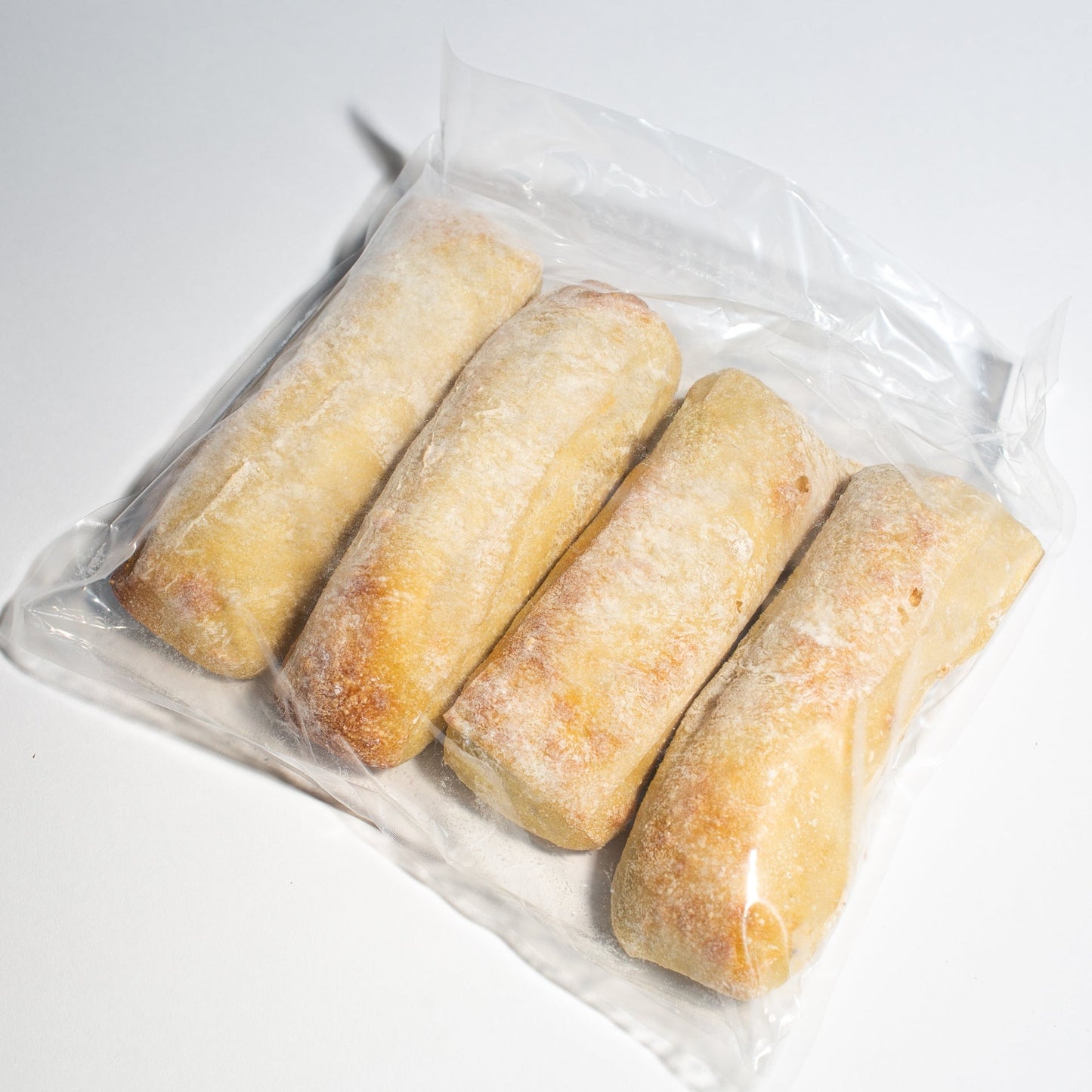 Demi baguettes to finish baking at home any time you need it! Enjoy the smell and the convenience of this easy product. Yann Haute Patisserie, pastry shop and bakery in Calgary.