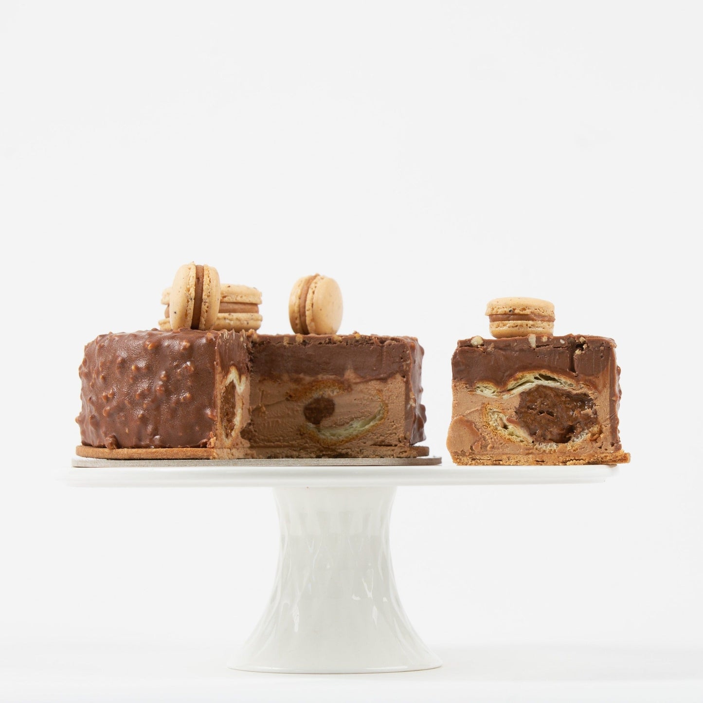 Yann's version of the traditional French Paris-Brest hazelnut cake brought to Calgary!  A center of hazelnut praline with hazelnut cream in a choux (cream puff) coated in chocolate with a macaron on top!