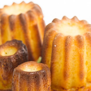 Canneles de Bordeaux for a unique texture and best flavours of vanilla in this pastry ! Yann Haute Patisserie, French bakery dessert shop Calgary